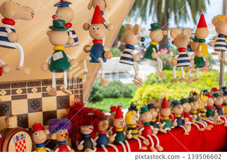 Wooden dolls and miscellaneous goods displayed in European markets Wooden dolls and miscellaneous goods displayed in European markets 139506602