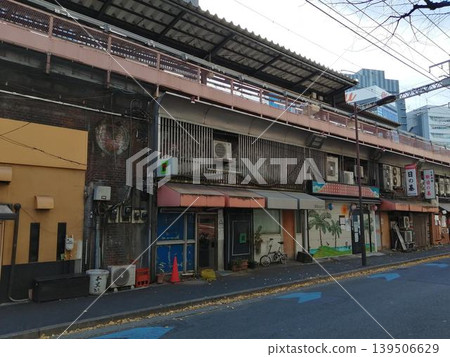 A retro shopping street nestled beneath the railway overpass and a townscape that retains the atmosphere of the Showa era. A retro shopping street nestled beneath the railway overpass and a townscape that retains the atmosphere of the Showa era. 139506629