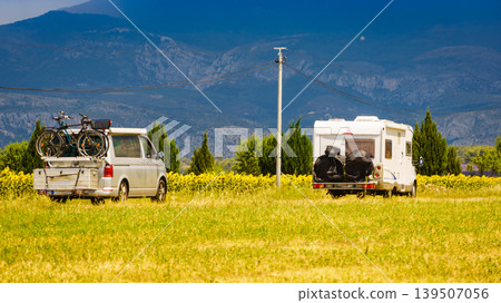 Two caravans camping on nature next to sunflower field, Provence in France Two caravans camping on nature next to sunflower field, Provence in France 139507056
