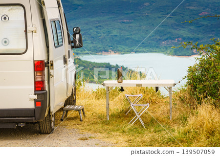 Camping van and table at lake Sainte Croix in Verdon Gorge, France Camping van and table at lake Sainte Croix in Verdon Gorge, France 139507059