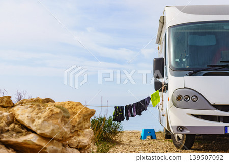 Clothes hanging to dry outdoors at caravan camp on sea shore 139507092