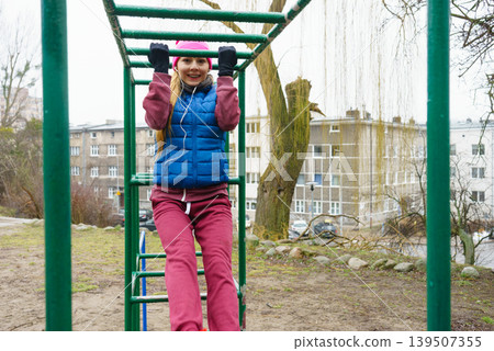 Sporty girl stretching exercising on fitness equipments. Sporty girl stretching exercising on fitness equipments. 139507355