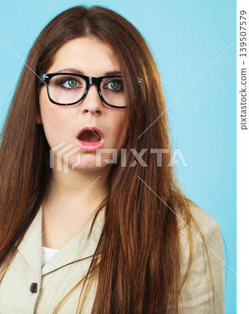 Shocked and surprised woman 139507579