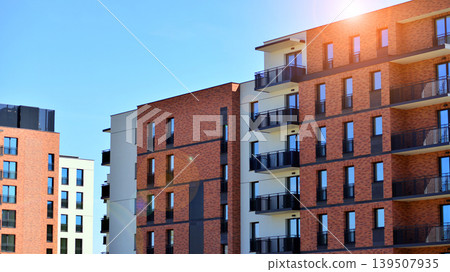 Downtown modern residential architecture. Architectural details of modern apartment building. Modern european residential apartment building complex. 139507935