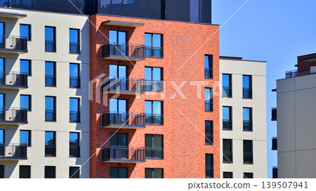 Downtown modern residential architecture. Architectural details of modern apartment building. Modern european residential apartment building complex. Downtown modern residential architecture. Architectural details of modern apartment building. Modern european residential apartment building complex. 139507941