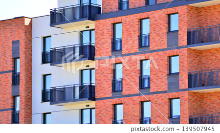 Downtown modern residential architecture. Architectural details of modern apartment building. Modern european residential apartment building complex. Downtown modern residential architecture. Architectural details of modern apartment building. Modern european residential apartment building complex. 139507945