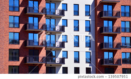 Downtown modern residential architecture. Architectural details of modern apartment building. Modern european residential apartment building complex. Downtown modern residential architecture. Architectural details of modern apartment building. Modern european residential apartment building complex. 139507951