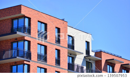 Downtown modern residential architecture. Architectural details of modern apartment building. Modern european residential apartment building complex. 139507953