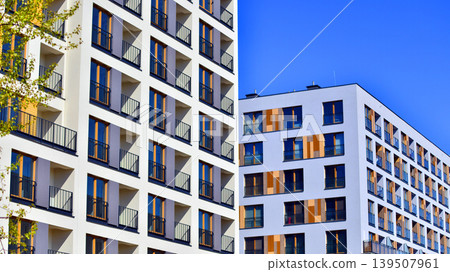 Downtown modern residential architecture. Architectural details of modern apartment building. Modern european residential apartment building complex. Downtown modern residential architecture. Architectural details of modern apartment building. Modern european residential apartment building complex. 139507961
