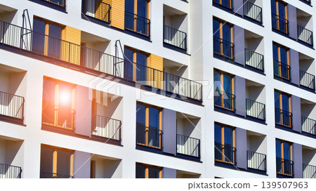 Downtown modern residential architecture. Architectural details of modern apartment building. Modern european residential apartment building complex. Downtown modern residential architecture. Architectural details of modern apartment building. Modern european residential apartment building complex. 139507963