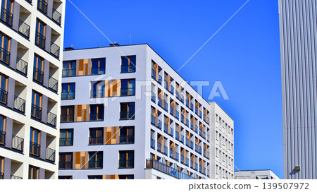 Downtown modern residential architecture. Architectural details of modern apartment building. Modern european residential apartment building complex. Downtown modern residential architecture. Architectural details of modern apartment building. Modern european residential apartment building complex. 139507972