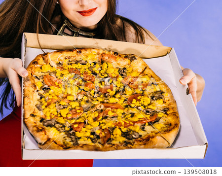 Woman holding big pizza in box Woman holding big pizza in box 139508018