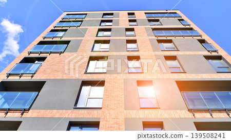 Downtown modern residential architecture. Architectural details of modern apartment building. Modern european residential apartment building complex. Downtown modern residential architecture. Architectural details of modern apartment building. Modern european residential apartment building complex. 139508241