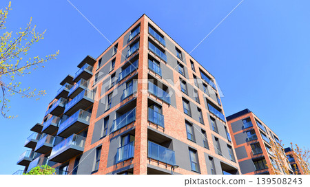 Downtown modern residential architecture. Architectural details of modern apartment building. Modern european residential apartment building complex. Downtown modern residential architecture. Architectural details of modern apartment building. Modern european residential apartment building complex. 139508243