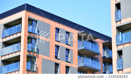 Downtown modern residential architecture. Architectural details of modern apartment building. Modern european residential apartment building complex. Downtown modern residential architecture. Architectural details of modern apartment building. Modern european residential apartment building complex. 139508265