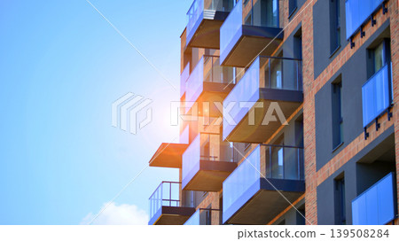 Downtown modern residential architecture. Architectural details of modern apartment building. Modern european residential apartment building complex. Downtown modern residential architecture. Architectural details of modern apartment building. Modern european residential apartment building complex. 139508284