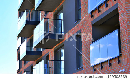 Downtown modern residential architecture. Architectural details of modern apartment building. Modern european residential apartment building complex. Downtown modern residential architecture. Architectural details of modern apartment building. Modern european residential apartment building complex. 139508289