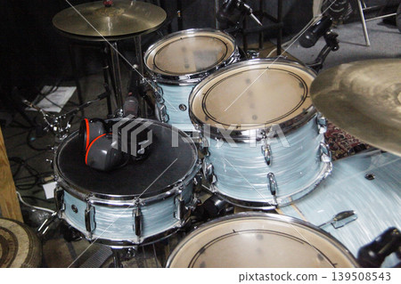 Drums are set up in a music studio with microphones attached. Drums are set up in a music studio with microphones attached. 139508543