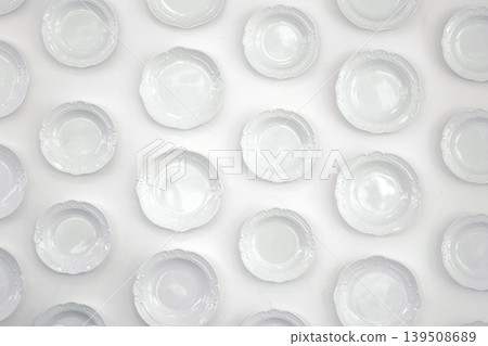 White plate decoration on the white wall. White tone interior background. White plate decoration on the white wall. White tone interior background. 139508689
