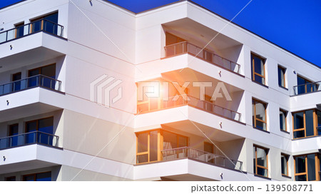 Downtown modern residential architecture. Architectural details of modern apartment building. Modern european residential apartment building complex. Downtown modern residential architecture. Architectural details of modern apartment building. Modern european residential apartment building complex. 139508771