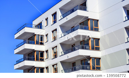 Downtown modern residential architecture. Architectural details of modern apartment building. Modern european residential apartment building complex. Downtown modern residential architecture. Architectural details of modern apartment building. Modern european residential apartment building complex. 139508772