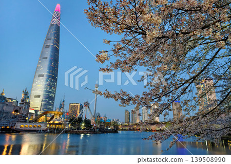 cherry blossom at Seokchon Lake with lotte world at dusk, Seoul cherry blossom at Seokchon Lake with lotte world at dusk, Seoul 139508990