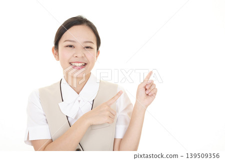 A smiling woman to point A smiling woman to point 139509356