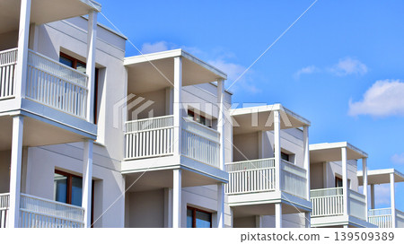 Downtown modern residential architecture. Architectural details of modern apartment building. Modern european residential apartment building complex. Downtown modern residential architecture. Architectural details of modern apartment building. Modern european residential apartment building complex. 139509389