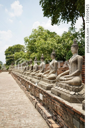 A procession of Buddha statues seen in Ayutthaya A procession of Buddha statues seen in Ayutthaya 139509425