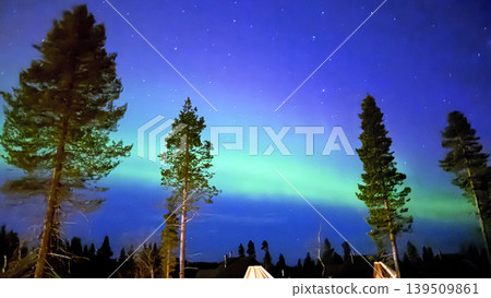 Aurora Borealis Over Snowy Winter Landscape in Finland Aurora Borealis Over Snowy Winter Landscape in Finland 139509861