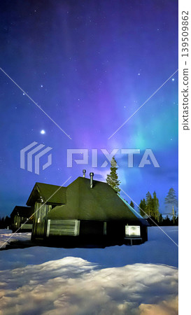Colorful Aurora Sky with Stars Above Nordic Cabin in Lapland Finland at Night Colorful Aurora Sky with Stars Above Nordic Cabin in Lapland Finland at Night 139509862