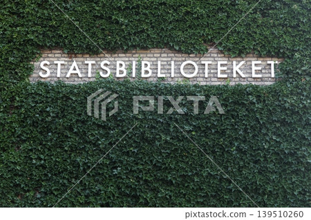 State library sign on a wall in Denmark called statsbiblioteket in Danish language State library sign on a wall in Denmark called statsbiblioteket in Danish language 139510260