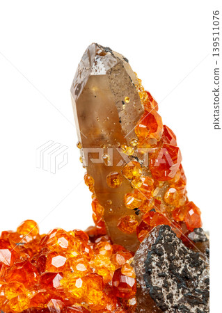 macro mineral stone Spessartine, orange, red garnet with quartz on white background 139511076
