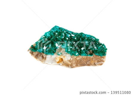Macro mineral stone Dioptase silicate copper on a white background Macro mineral stone Dioptase silicate copper on a white background 139511080
