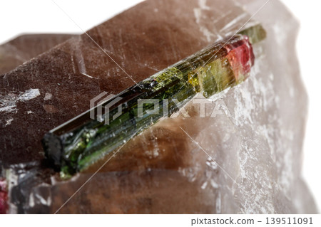 Macro mineral tourmaline stone in quartz on a white background Macro mineral tourmaline stone in quartz on a white background 139511091