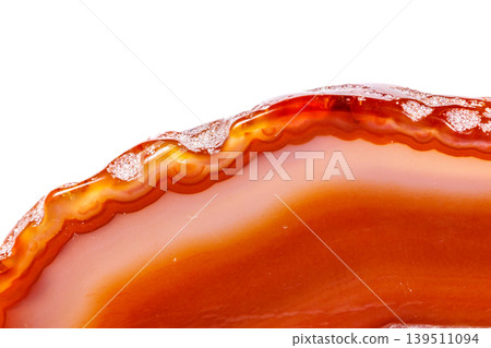 Macro mineral orange agate in crystals on white background Macro mineral orange agate in crystals on white background 139511094