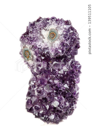 Macro mineral stone Amethyst eye, in the form of an owl on a white background Macro mineral stone Amethyst eye, in the form of an owl on a white background 139511105