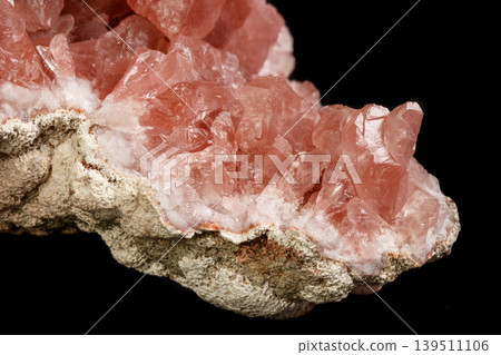 Macro mineral stone Pink Amethyst on a black background Macro mineral stone Pink Amethyst on a black background 139511106