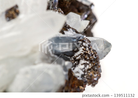 Macro mineral stone Drusus quartz with sphalerite in the rock a white background Macro mineral stone Drusus quartz with sphalerite in the rock a white background 139511132
