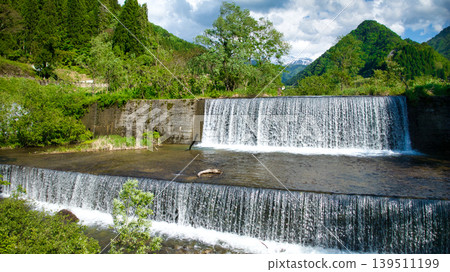 In May, snowmelt water flows through a small stream in eastern Toyama Prefecture. In May, snowmelt water flows through a small stream in eastern Toyama Prefecture. 139511199