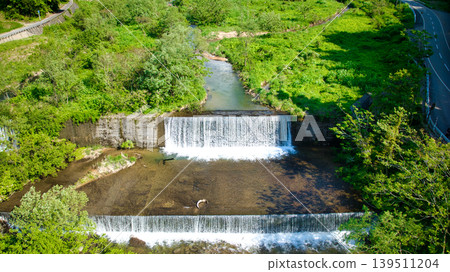 In May, snowmelt water flows through a small stream in eastern Toyama Prefecture. In May, snowmelt water flows through a small stream in eastern Toyama Prefecture. 139511204