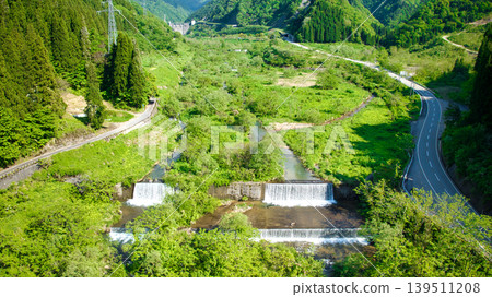 In May, snowmelt water flows through a small stream in eastern Toyama Prefecture. In May, snowmelt water flows through a small stream in eastern Toyama Prefecture. 139511208