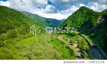In May, snowmelt water flows through a small stream in eastern Toyama Prefecture. 139511216