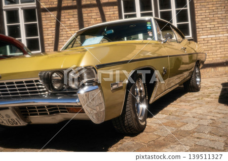 Berlin, Germany - May 2, 2026. Gold Chevrolet at car show Berlin, Germany - May 2, 2026. Gold Chevrolet at car show 139511327