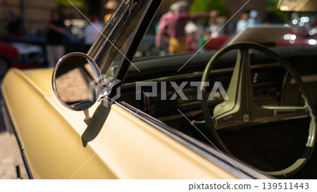 Berlin, Germany - May 2, 2026. Classic car mirror and steering wheel Berlin, Germany - May 2, 2026. Classic car mirror and steering wheel 139511443