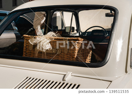 Berlin, Germany - May 2, 2026. Picnic basket in classic car at Oldtimer Open Air Berlin, Germany - May 2, 2026. Picnic basket in classic car at Oldtimer Open Air 139511535
