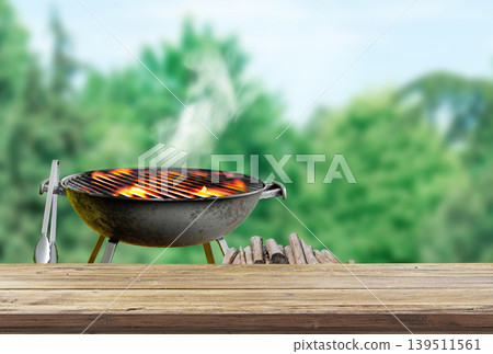 backyard with seating and lush greenery, patio area with green lawn and bbq grill blurred, wooden board backyard with seating and lush greenery, patio area with green lawn and bbq grill blurred, wooden board 139511561