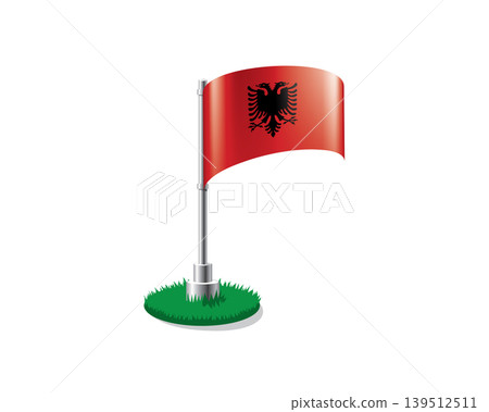 Albanian flag on a flagpole mounted on the grass Albanian flag on a flagpole mounted on the grass 139512511
