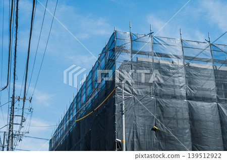 Building repair site with scaffolding erected Building repair site with scaffolding erected 139512922