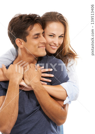 Happy couple, hug and love in care, compassion or trust for embrace against a white studio background. Handsome man and young woman smile for romance, affection or relationship together on mockup 139513406